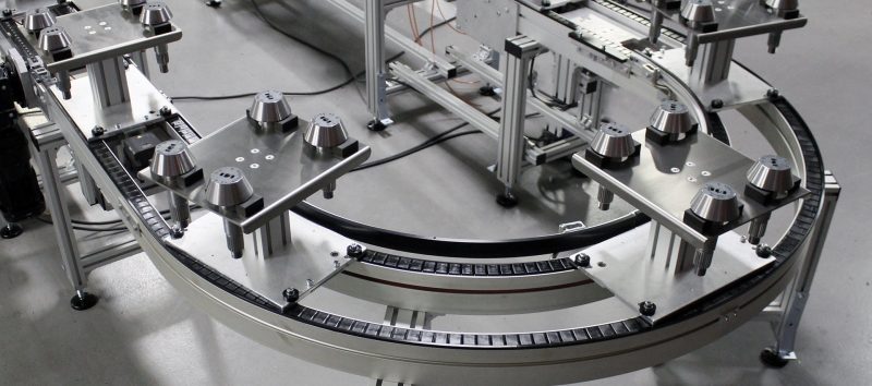 curve pallet handling conveyor system with automotive parts 1
